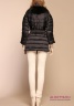 Пуховая куртка NAUMI N17 38 02 BLACK - черный​ приталенного силуэта, декорированная мехом енота. Ткань матовая тафета.​ Фото 3